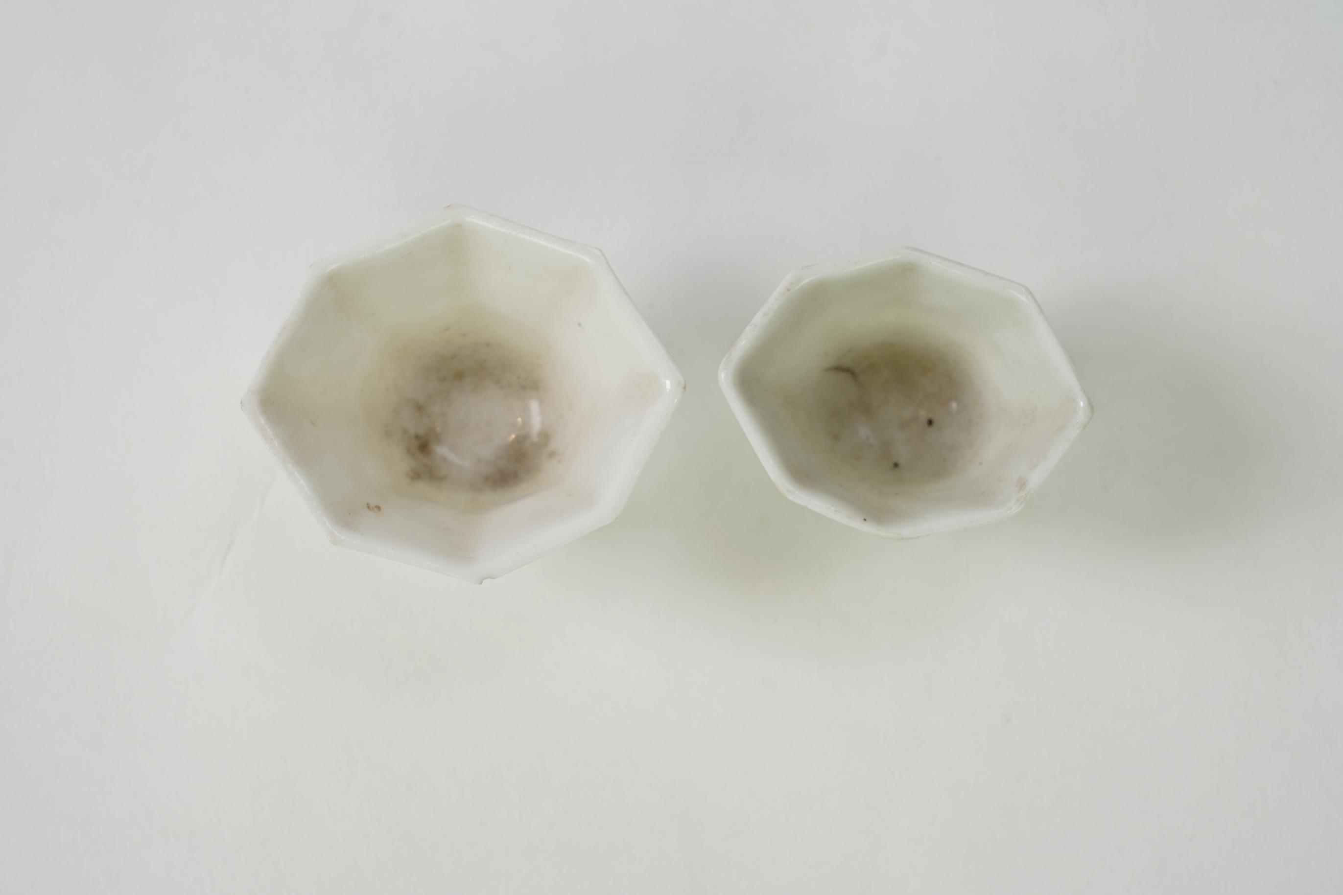 Two Chinese Dehua blanc de chine octagonal cups, Kangxi period
